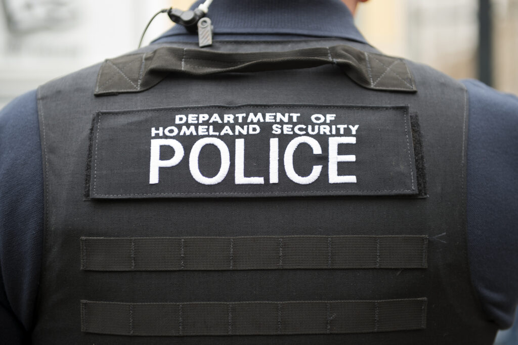Photo of police officer during mass deportations in schools
