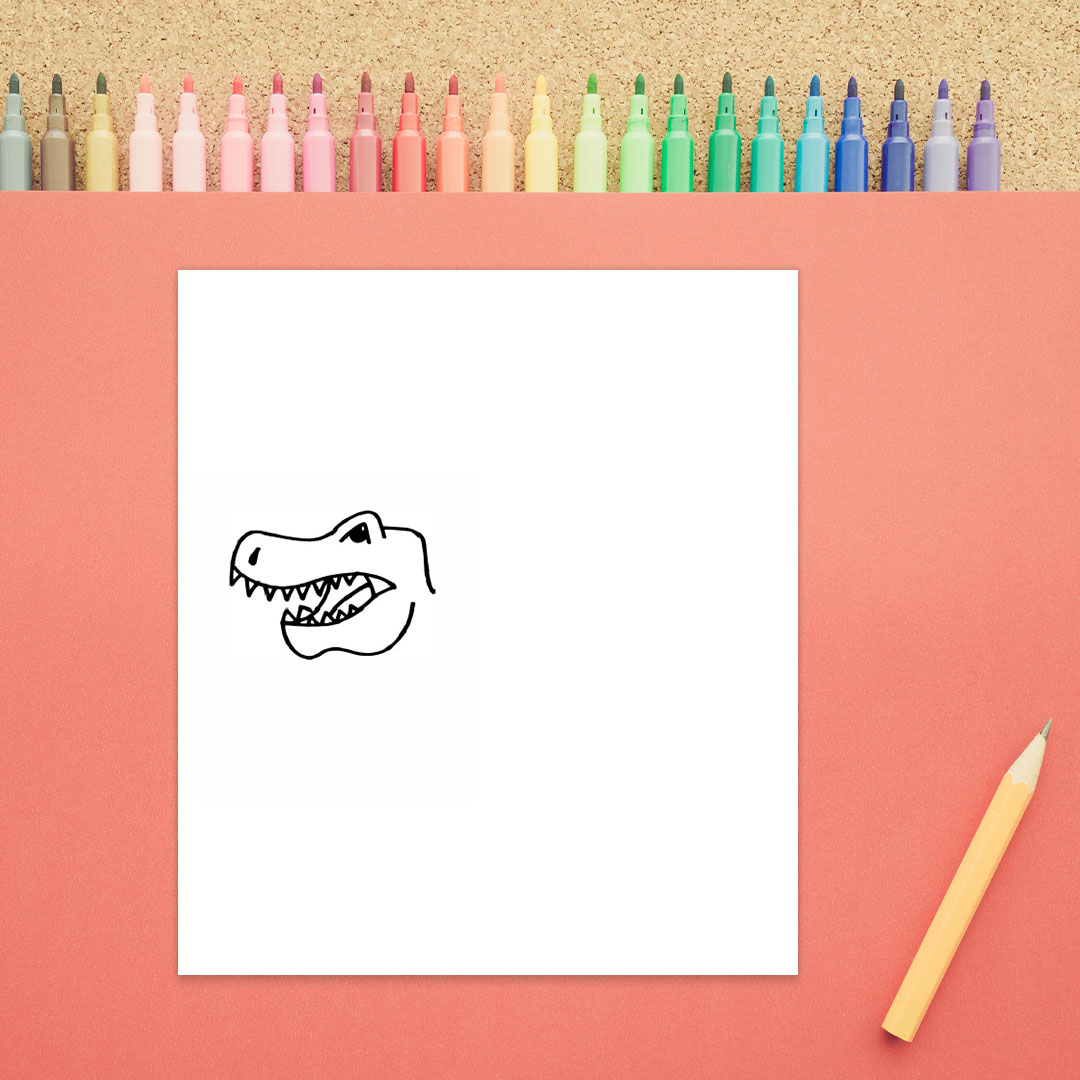 The top of a dinosaur's head is shown with a long nose, eye, and open mouth showing teeth.