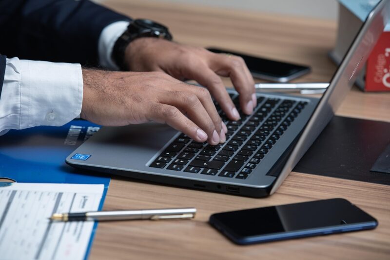 man writing on keyboard, writing career example 