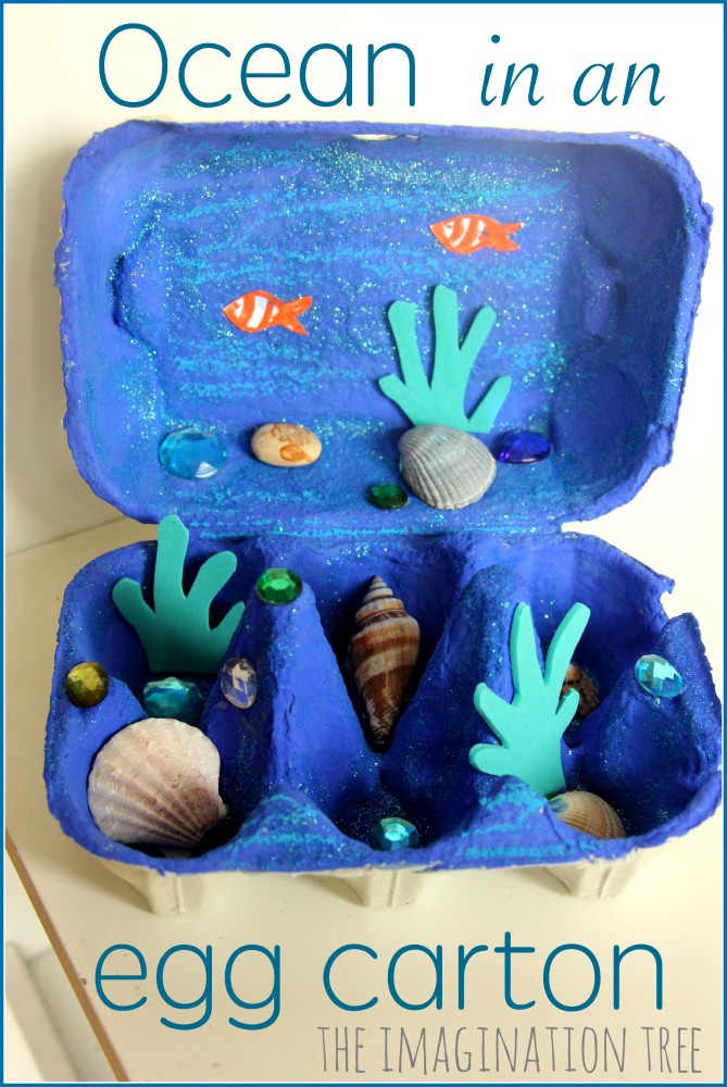 eggcarton An egg carton is painted dark blue and filled with shells and has sea creature stickers stuck to it.