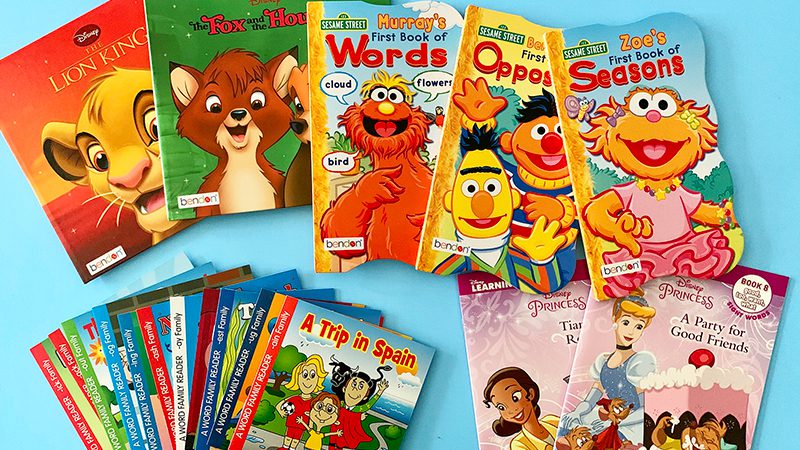 little-kids-books Multiple books for different age ranges span out on a light blue background.