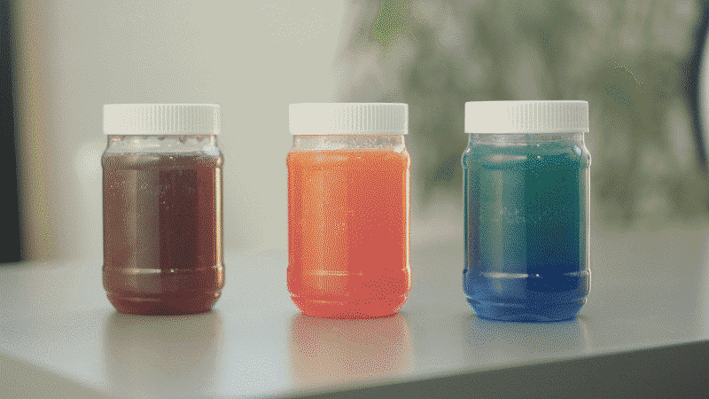 calm-down-jars-gif Small plastic jars with white lids with colored liquid inside