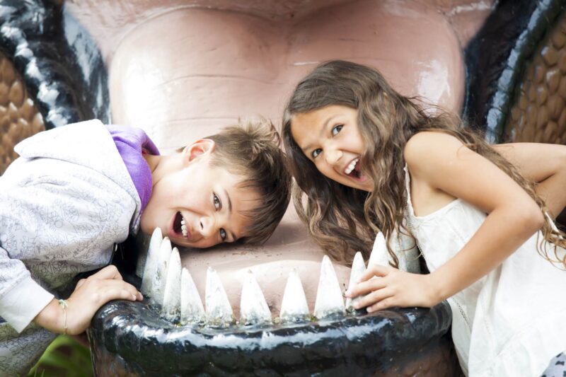 Picture Writing Prompts: Dinosaur Mouth Two happy children are having fun pretending to be in the dinosaur jaw