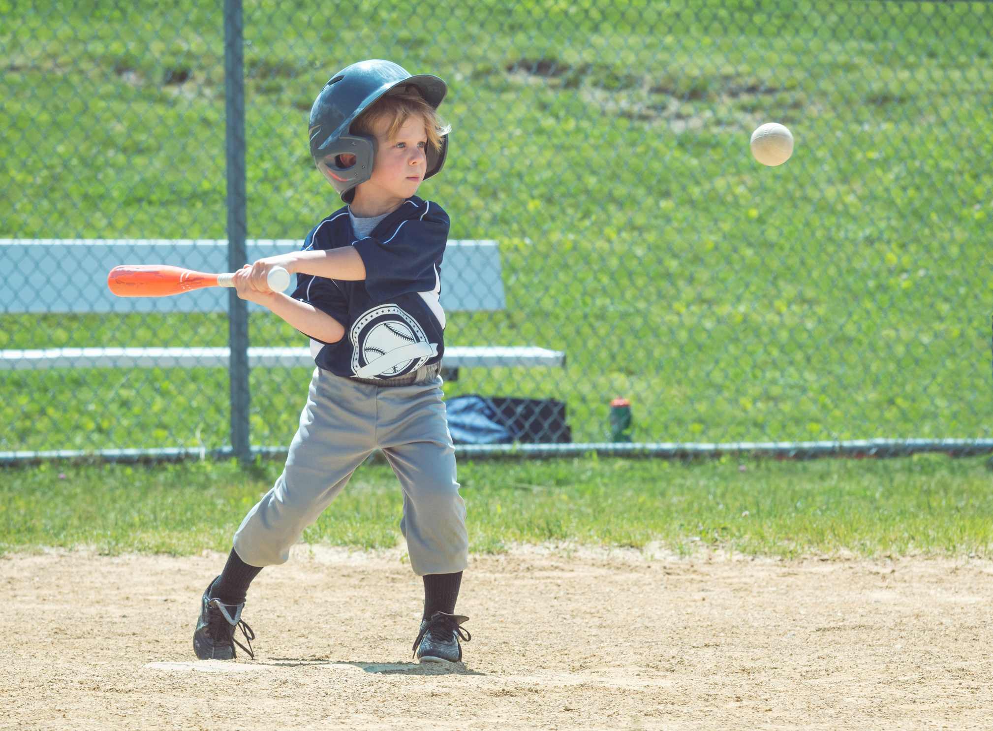 Picture Prompts: The Final Pitch A little boy swings at an incoming baseball.