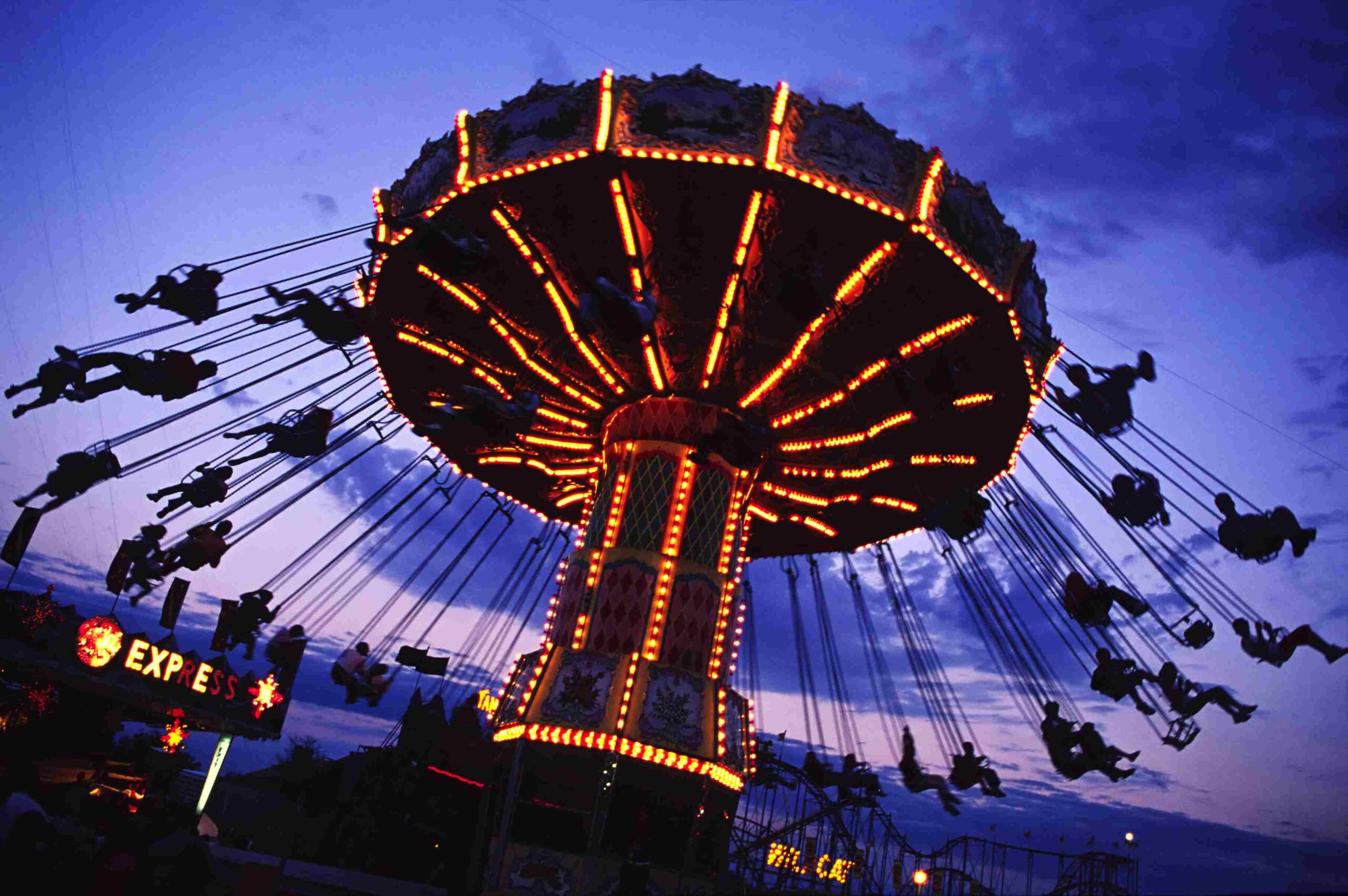 Picture Writing Prompts: Sky Swings Amusement park giant swing ride, lit up against a purple sky