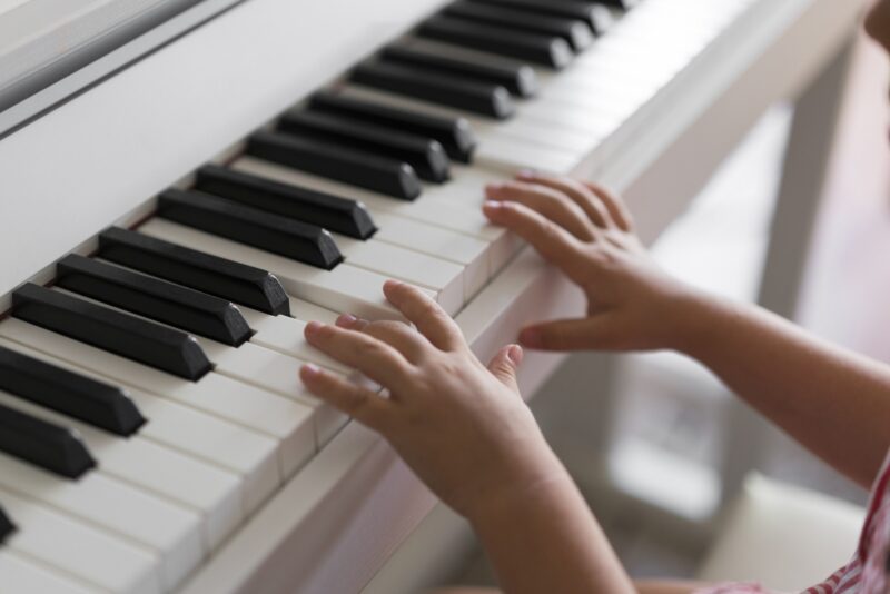Picture Writing Prompts: Piano Lessons Little girl's small hands playing a piano