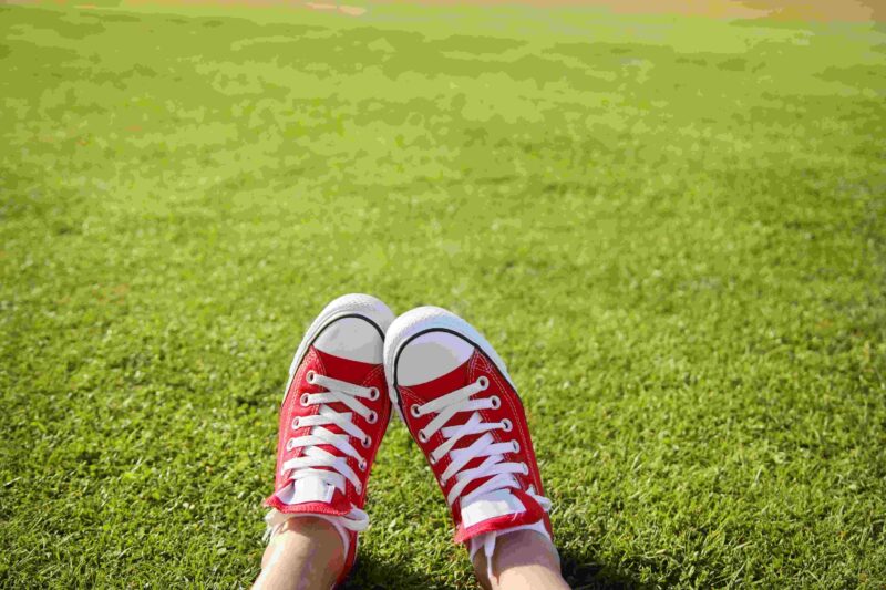Picture Writing Prompts: New Shoes Feet in red sneakers in the green grass