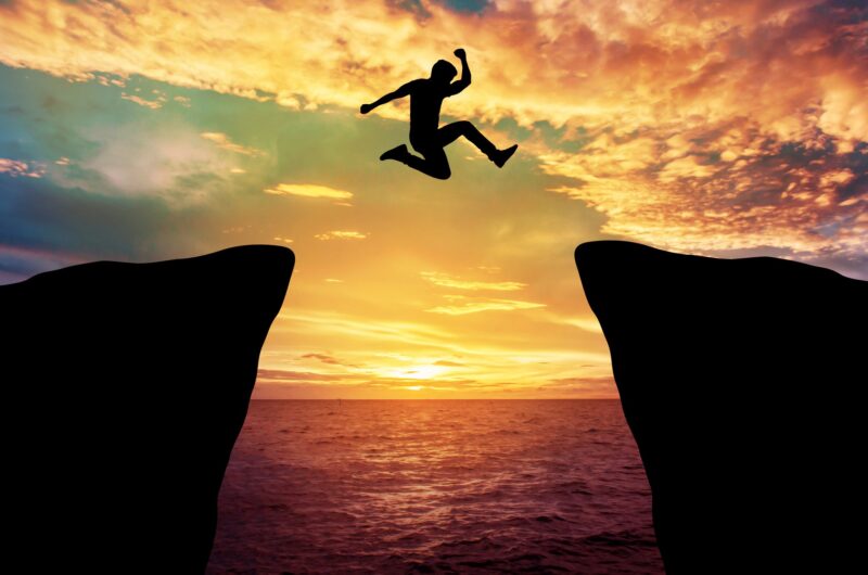 Picture Prompts: Sunset Leap Man jump through the gap between hill.