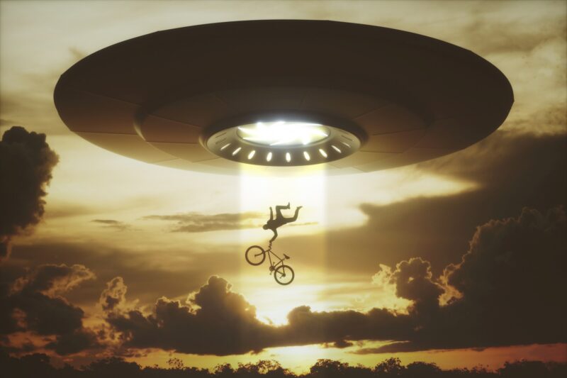 Picture Prompts: UFO People levitating into an alien ship.
