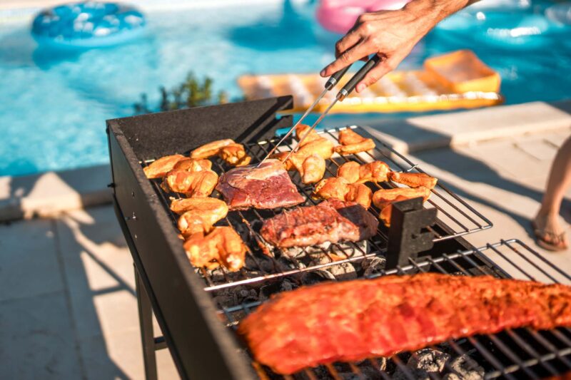 Picture Writing Prompts: Cookout Close up on sizzling meat on the grill at a pool party