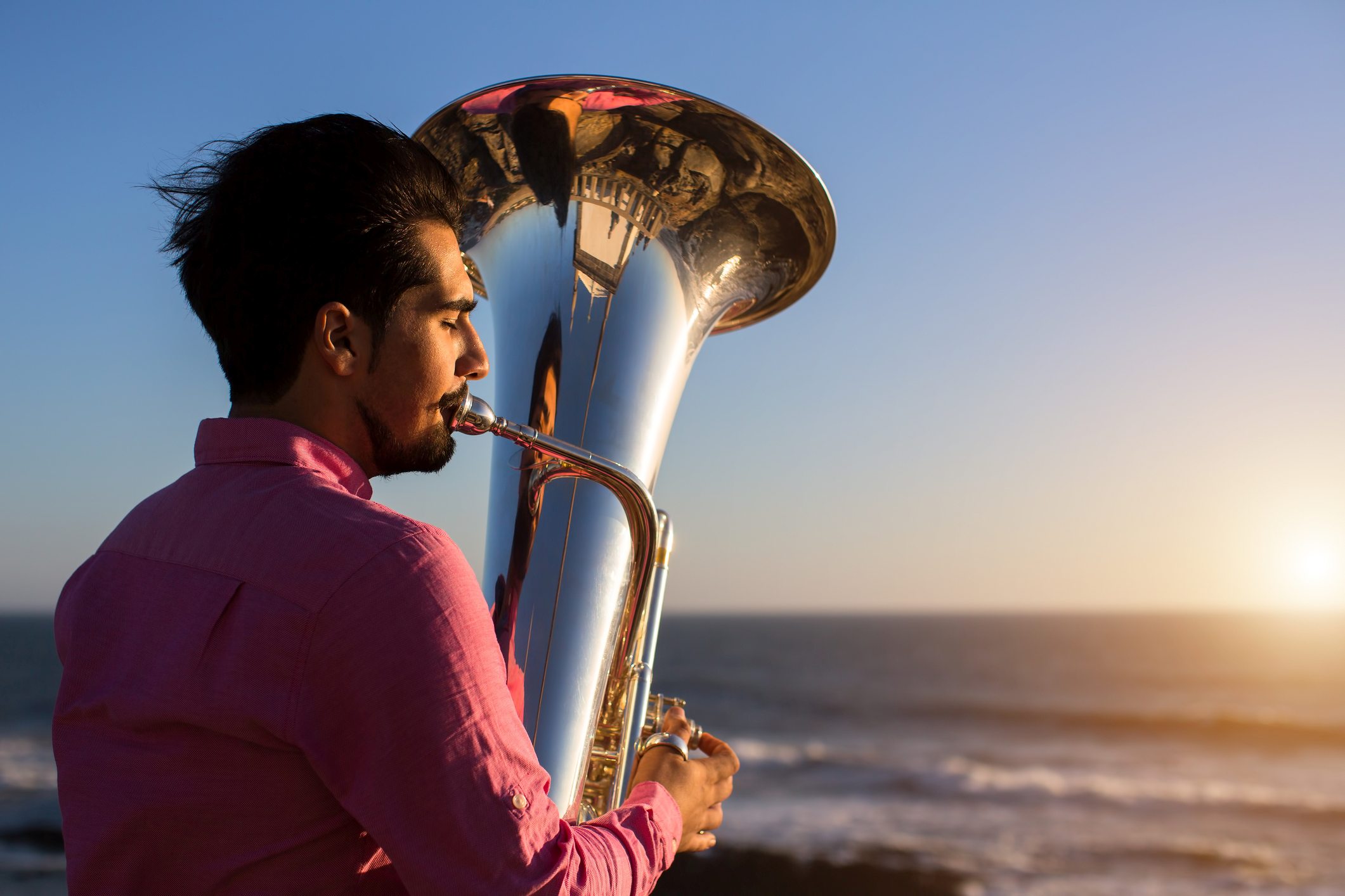 Picture Writing Prompts: Beach Tuba Man playing tuba on the beach looking out to sea
