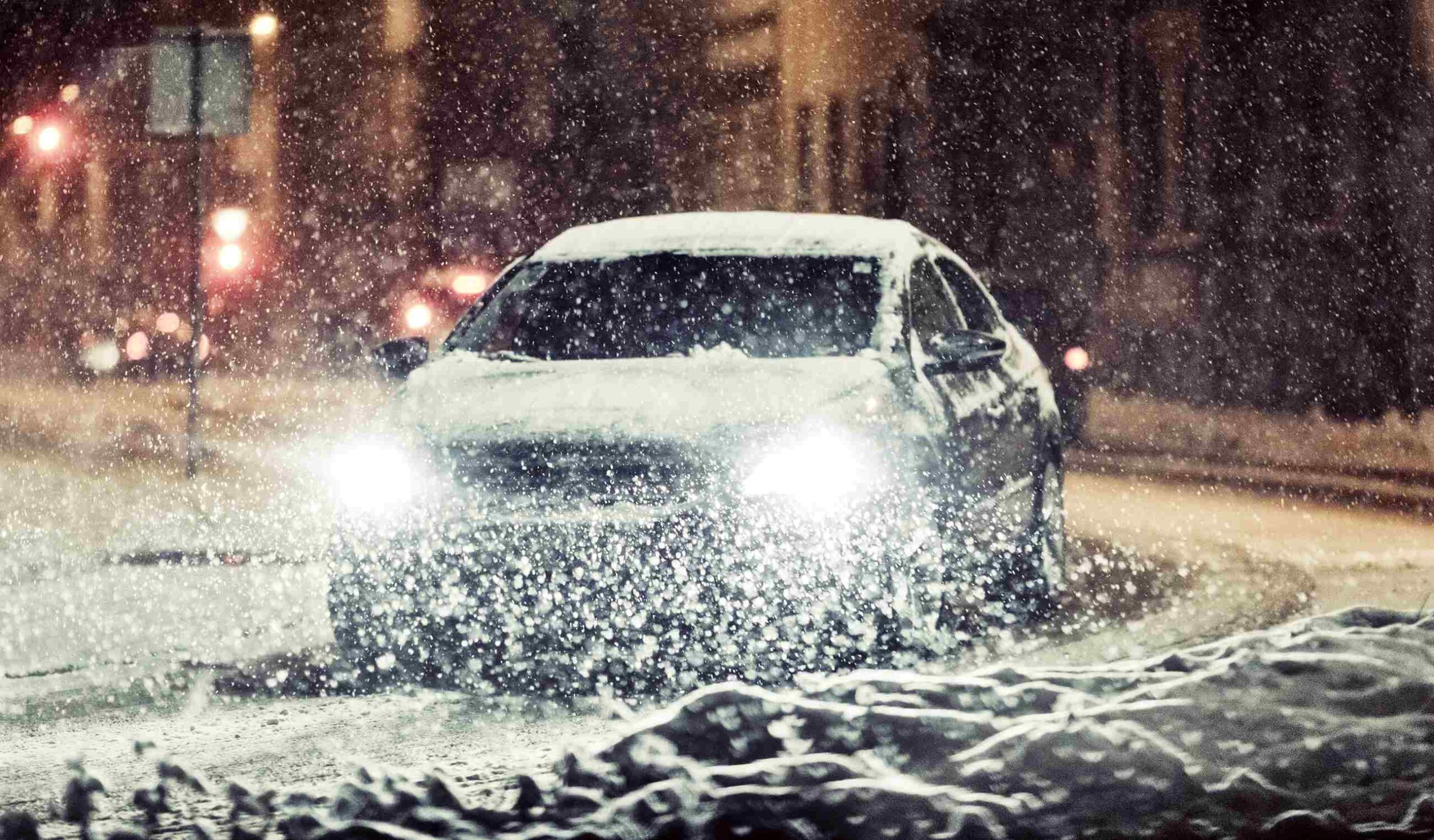 Picture Prompts: Snowstorm Car driving through a severe snow storm at night