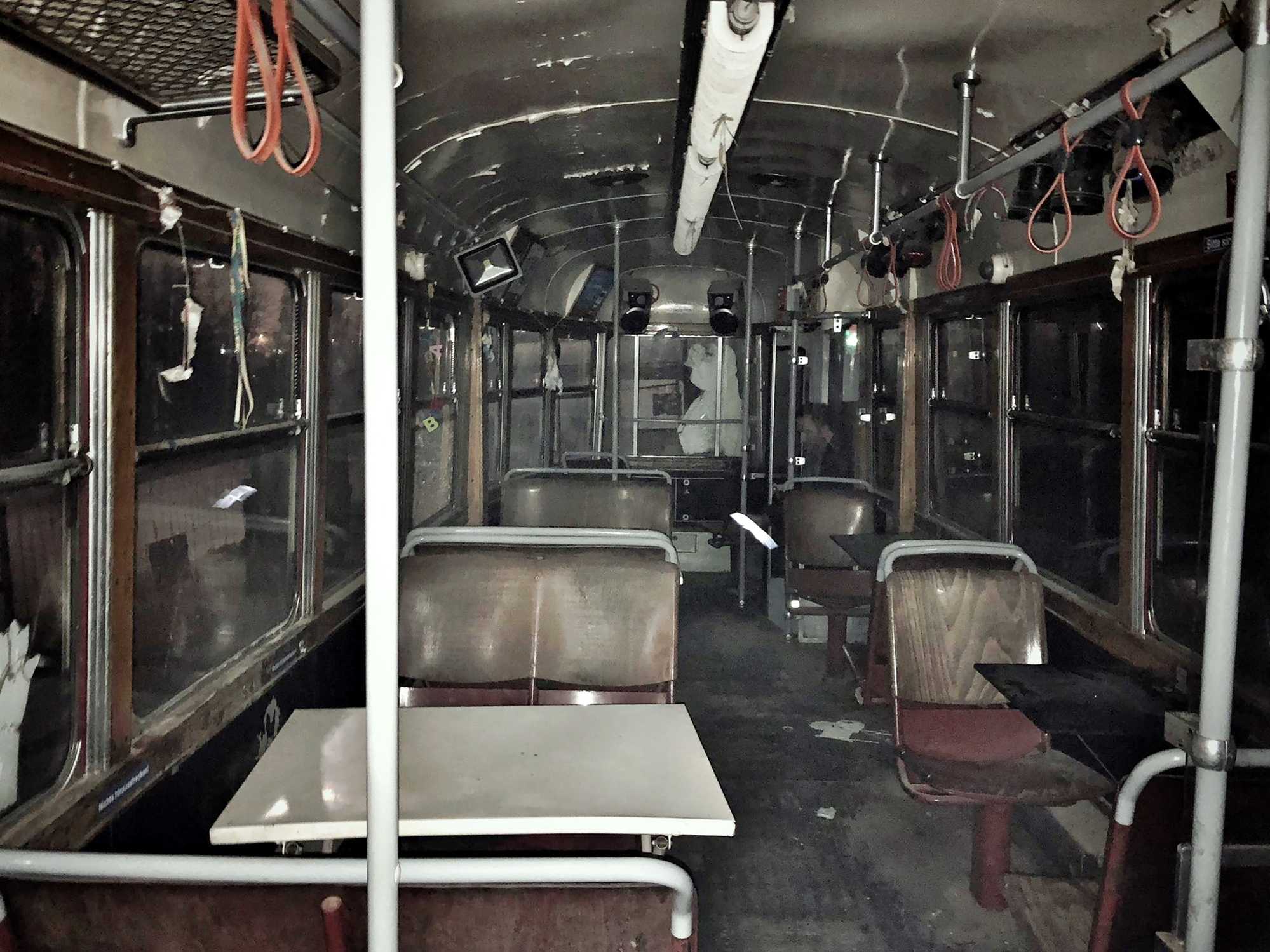 Picture Prompts: Old Train Abandoned train car with benches and tables