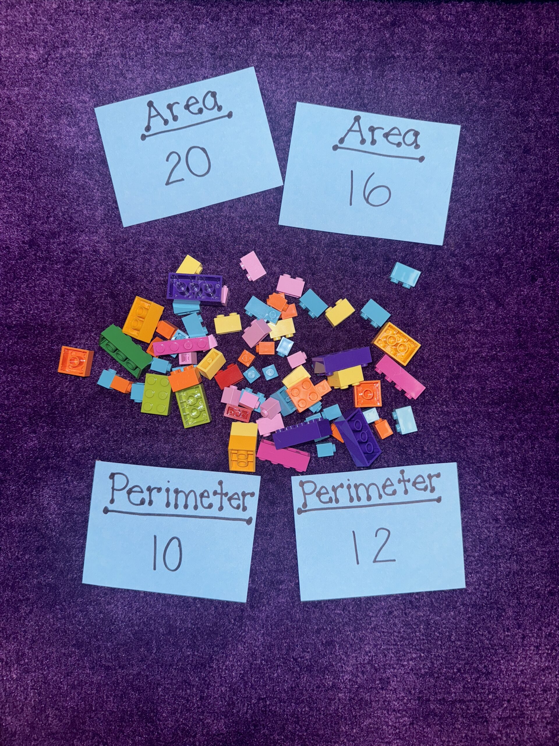 LegoLand Legos and set of cards with areas and perimeters written on them