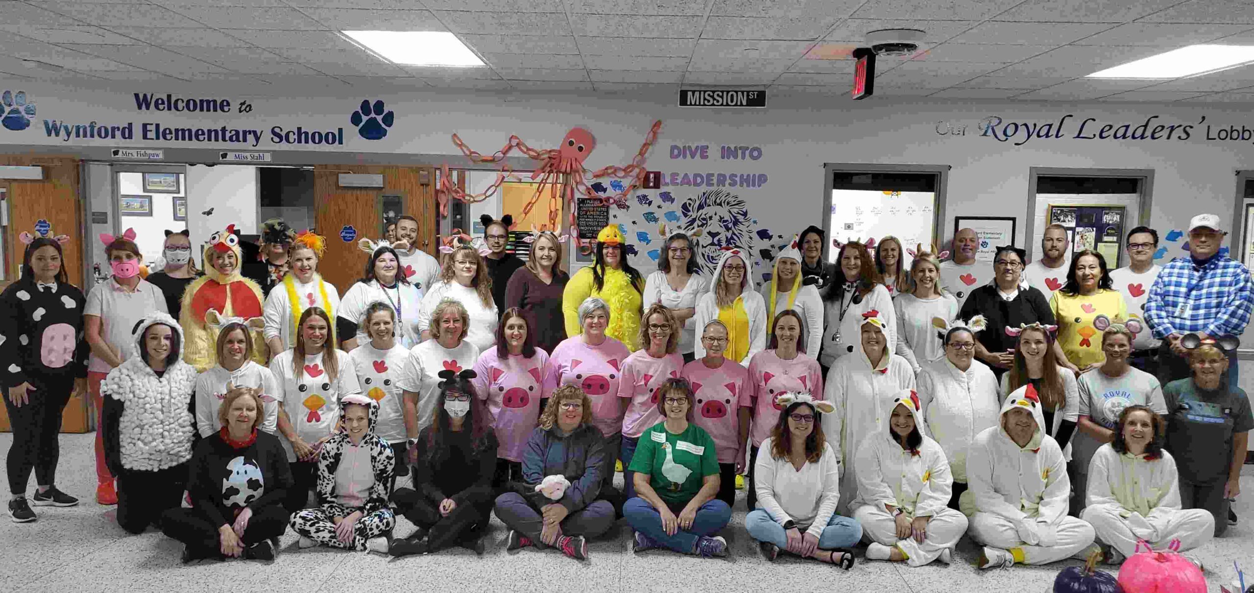Teachers and school staff dressed as farm animals and other characters from Charlotte's Web