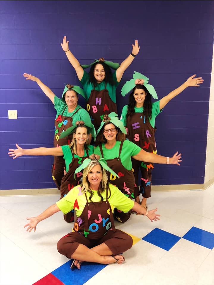 Group of teachers dressed to represent the book Chicka Chicka Boom Boom