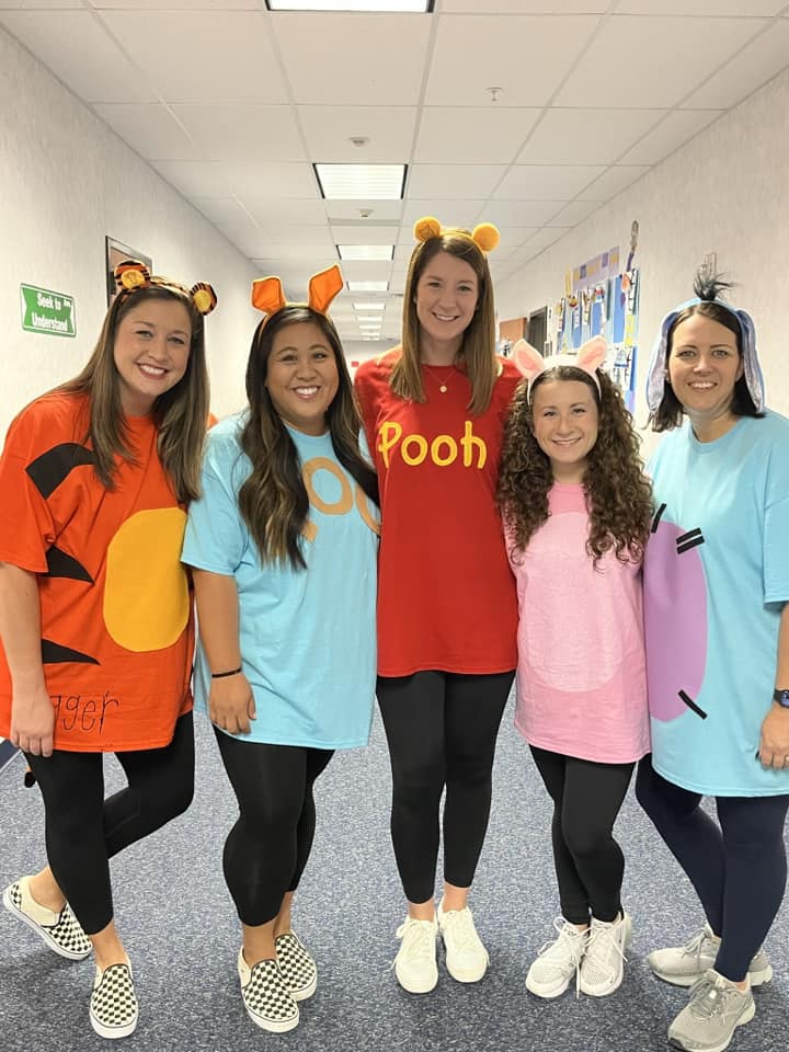 Teachers dressed as Winnie the Pooh characters for Halloween