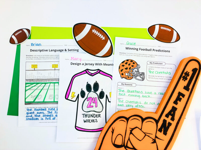 Three completed football worksheets on a table.