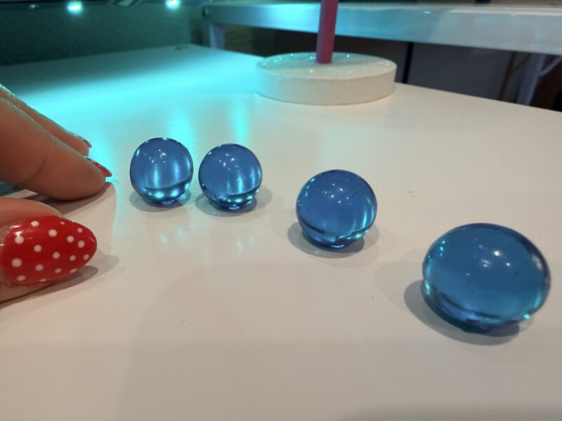 an image of a first grade science experiment: marbles