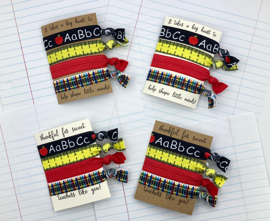 Sets of teacher hair ties with school themes