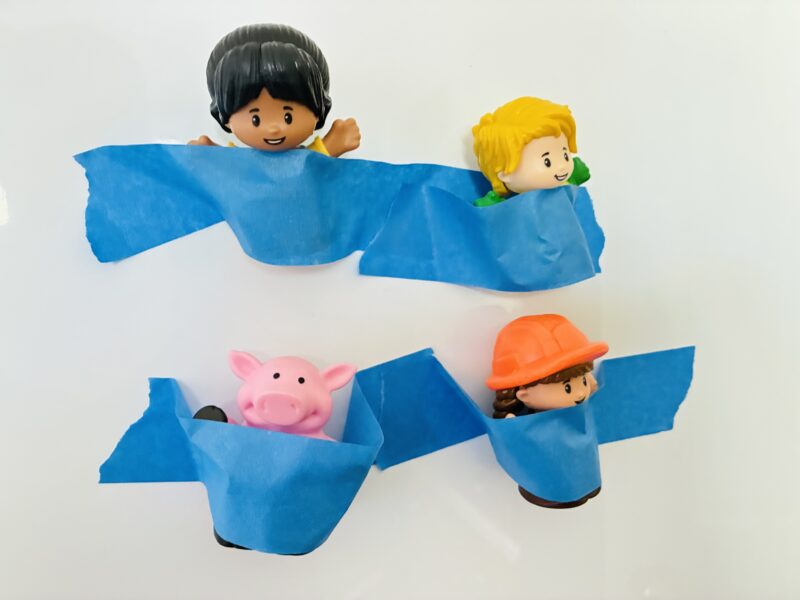 an image of a fine motor activity that has students rescue toys from painters tape