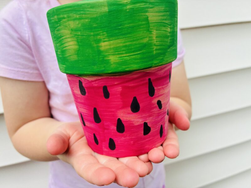 Summer Crafts for Kids a summer craft for kids that involves painting a plant pot like a watermelon