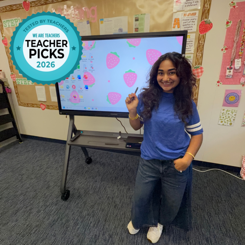 Teacher Picks ViewSonic ViewBoard – Teacher Smiling Teacher Marieum Ahmad standing in front of ViewSonic ViewBoard in classroom.